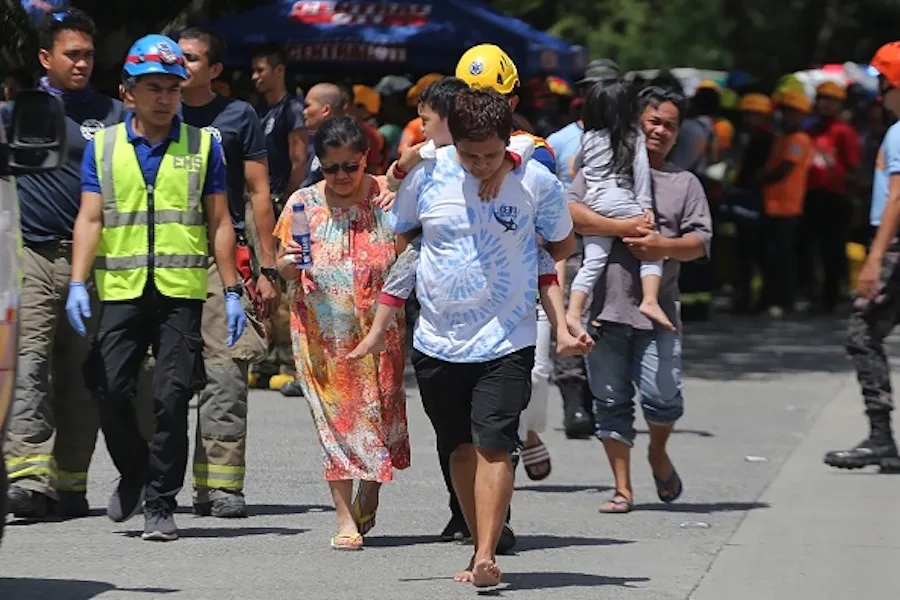 Residents are evacuated from a damaged condominium building after a 6.5-magnitude earthquake hit Davao City in the southern island of Mindanao on October 31, 2019. ?w=200&h=150
