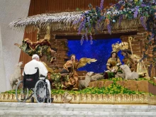 Pope Francis spent time in silent prayer in front of a nativity scene handmade by artisan craftsmen in Guatemala on Dec. 3, 2022.