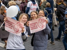Young girls hold posters that translate to “Every Life is Important and Precious” at the March for Life in Vilnius, Lithuania, on Oct. 4, 2025.
