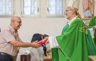 Patriarch Cardinal Pierbattista Pizzaballa presents a Bible to a catechism teacher on Sept. 27, 2025, in Galilee. Credit: Latin Patriarchate of Jerusalem