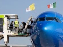 Pope Francis prepares to board an ITA Airlines plane for his approximately 10-hour flight from Rome to Edmonton in western Canada on July 24, 2022.