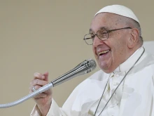 Pope Francis smiles while addressing pilgrims at a vigil gathering on Aug. 5, 2023, at World Youth Day in Lisbon, Portugal.