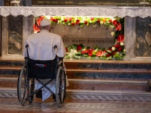 Pope Francis prays in front of the tomb of St. Mark the Evangelist inside St. Mark's Basilica in Venice on April 28, 2024.