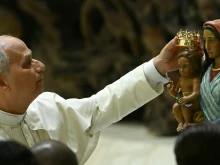 Pope Leo XIV places a crown on the Madonna of Sinti, Roma, and Walking Peoples during the audience of the Jubilee of the Roma, Sinti, and Traveling Peoples in Paul VI Hall at the Vatican on Oct. 18, 2025.