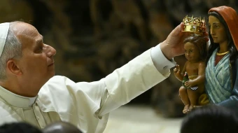 Pope Leo XIV places a crown on the Madonna of Sinti, Roma, and Walking Peoples during the audience of the Jubilee of the Roma, Sinti, and Traveling Peoples in Paul VI Hall at the Vatican on Oct. 18, 2025.