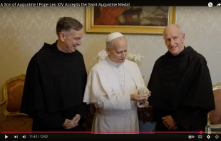 Pope Leo XIV accepts the Medal of St. Augustine from Father Robert P. Hagan, OSA, prior provincial of the Augustinian Province of St. Thomas of Villanova (right) and Father Joseph Farrell, OSA, vicar general of the Order of St. Augustine (left) in a video released on Aug. 28, 2025. Credit: Screenshot from the YouTube page of the Augustinian Province of St. Thomas of Villanova