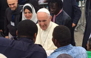 Pope Francis meets with migrants during a day trip to Bologna, Italy.   Marco Mancini/CNA