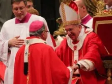 Pope Francis greets one of the 34 metropolitan archbishops to receive the pallium on the Feast of Saints Peter and Paul in St. Peter's Basilica on June 29, 2013. 