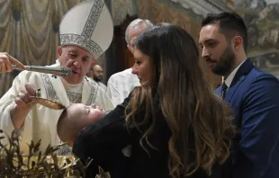 Pope Francis baptizes a child in the Sistine Chapel on Jan. 12, 2020.   Vatican Media.