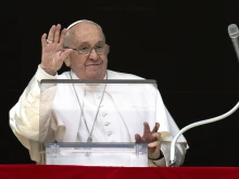 Pope Francis waves to pilgrims gathered in St. Peter’s Square during his Sunday Angelus on March 17, 2024.