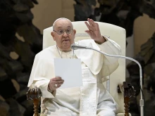 Pope Francis waves to pilgrims gathered for his general audience on Wednesday, Jan. 8, 2025, in Paul VI Hall at the Vatican.