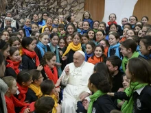 Pope Francis greets pilgrims gathered for his Wednesday general audience on Feb. 5, 2025, in the Paul VI Audience Hall at the Vatican.