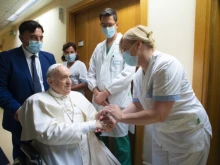 Pope Francis greets staff at the Gemelli Hospital in Rome, July 11, 2021.