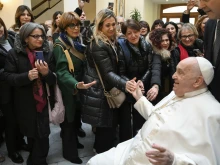 Pope Francis greets members of the Interprovincial Order of the Profession of Midwifery of Catanzaro on Feb. 6, 2025, at his Casa Santa Marta residence at the Vatican.