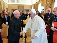 Pope Francis greets Archbishop Vincenzo Paglia, the president of the Pontifical Academy for Life, on Feb. 20, 2023.