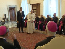 Pope Francis walks with a cane at the beginning of a meeting with Brazilian bishops on June 27, 2022.