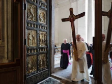 Pope Leo XIV passes through the Holy Door carrying the jubilee cross as he leads the pilgrimage of the Holy See on June 9, 2025.