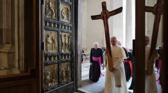 Pope Leo XIV passes through the Holy Door carrying the jubilee cross as he leads the pilgrimage of the Holy See on June 9, 2025.