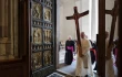Pope Leo XIV passes through the Holy Door carrying the jubilee cross as he leads the pilgrimage of the Holy See on June 9, 2025.