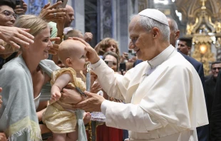 Pope Leo XIV blesses a baby during his Wednesday general audience in St. Peter’s Basilica on Aug. 13, 2025, at the Vatican. Credit: Vatican Media