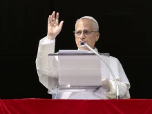 Pope Leo XIV waves to pilgrims gathered in St. Peter’s Square for his Sunday Angelus on Oct. 26, 2025, at the Vatican.