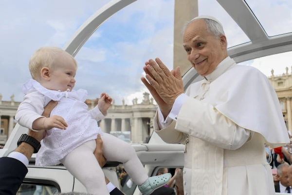 Pope Leo XIV greets a baby during his general audience on Sept. 24, 2025, in St. Peter’s Square at the Vatican. Credit: Vatican Media