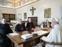 Pope Leo XIV receives Bishop Pierre Goudreault of Sainte-Anne-de-la-Pocatière, president of the Canadian Conference of Catholic Bishops (center), Archbishop Richard Smith of Vancouver (right), and Father Jean Vézina, secretary-general of the Canadian bishops (left), in a Nov. 15, 2025, meeting at which the Holy Father gifted dozens of artifacts that originated with Indigenous peoples of the North American country. Leo at the meeting donated 62 pieces from the ethnological collections of the Vatican Museums to the Canadian bishops.
