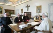 Pope Leo XIV receives Bishop Pierre Goudreault of Sainte-Anne-de-la-Pocatière, president of the Canadian Conference of Catholic Bishops (center), Archbishop Richard Smith of Vancouver (right), and Father Jean Vézina, secretary-general of the Canadian bishops (left), in a Nov. 15, 2025, meeting at which the Holy Father gifted dozens of artifacts that originated with Indigenous peoples of the North American country. Leo at the meeting donated 62 pieces from the ethnological collections of the Vatican Museums to the Canadian bishops.