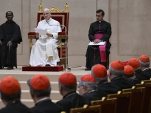 Pope Leo XIV addresses officials of the Roman Curia at the Vatican on Dec. 22, 2025.