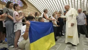 Pope Leo XIV meets with Ukrainian children who were welcomed by Caritas Italy during the summer on July 3, 2025, at the Vatican.