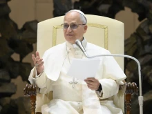 Pope Leo XIV addresses employees of the Vatican on Dec. 22, 2025, in the Paul VI Audience Hall at the Vatican.