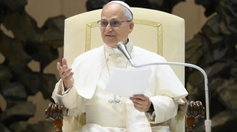 Pope Leo XIV addresses employees of the Vatican on Dec. 22, 2025, in the Paul VI Audience Hall at the Vatican.