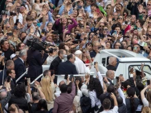Pope Francis greets the crowd from the popemobile on Easter Sunday morning, April 20, 2025.