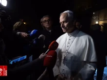 Pope Leo XIV answers questions from journalists as he leaves the papal residence of Castel Gandolfo on Tuesday, Nov. 18, 2025.