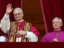 Pope Leo XIV looks out from the central balcony of St. Peter’s Basilica after his election on May 8, 2025.