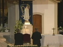Pope Benedict prays at the candle light vigil.