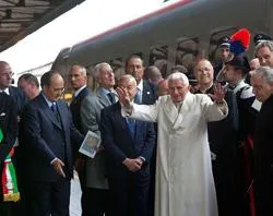Pope Benedict XVI greets a crowd as he arrives in Assisi, Italy on Oct. 27, 2011. ?w=200&h=150