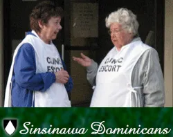 Sister Donna Quinn and standing with another abortion clinic escort (L to R)?w=200&h=150
