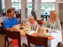 A family eating a meal together. Getty Images/Jupiterimages/Comstock