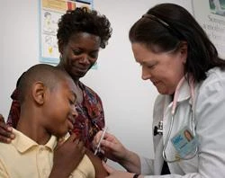 A 13-year-old boy receives a vaccination. ?w=200&h=150