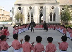 Children gather with their instructors outside of the damaged church in Sukkur?w=200&h=150