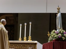 Pope Leo XIV stands before the original Our Lady of Fatima statue at a Marian vigil in St. Peter’s Square, Rome, Saturday, Oct. 11, 2025.