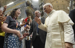 Pope Leo XIV blesses Elizabeth Busby and her baby on the way at the Mass for Digital Missionaries on July 29, 2025, at St. Peter’s Basilica at the Vatican. A family and marriage therapist, Busby hosts the “Discerning Marriage” podcast and developed the Next Step formation program for people who are discerning marriage. Credit: Vatican Media