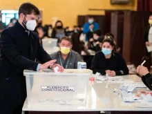 President Gabriel Bóric of Chile votes in a Sept. 4, 2022, election for proposed changes to the country’s constitution.