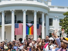 The Progress Pride flag is shown above (center flag) at a White House "Pride" celebration on June 10, 2023.