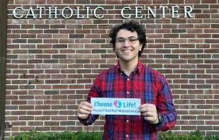 Gabriel Dionisi, a 22-year-old college student who makes pro-life bumper stickers with the goal of spreading the pro-life message and spread awareness to others, displays one of his works. Credit: Gabriel Dionisi