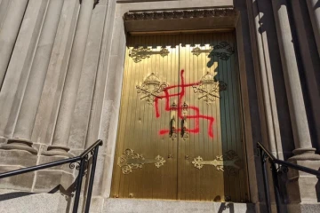 Vandalism on a door of the Cathedral Basilica of the Immaculate Conception in Denver, Colo., Oct. 10, 2021.