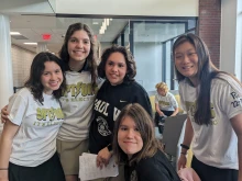 Options Students Mia Butler and Veronica Caravan with their peer mentors at an end-of-year celebration.