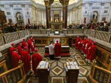 Bishops from USCCB Region XIII pray before the tomb of St. Paul after offering Mass Feb. 12, 2020. 