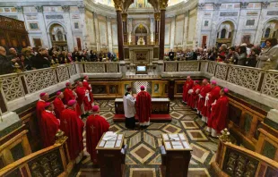 Bishops from USCCB Region XIII pray before the tomb of St. Paul after offering Mass Feb. 12, 2020.   Daniel Ibanez/CNA.
